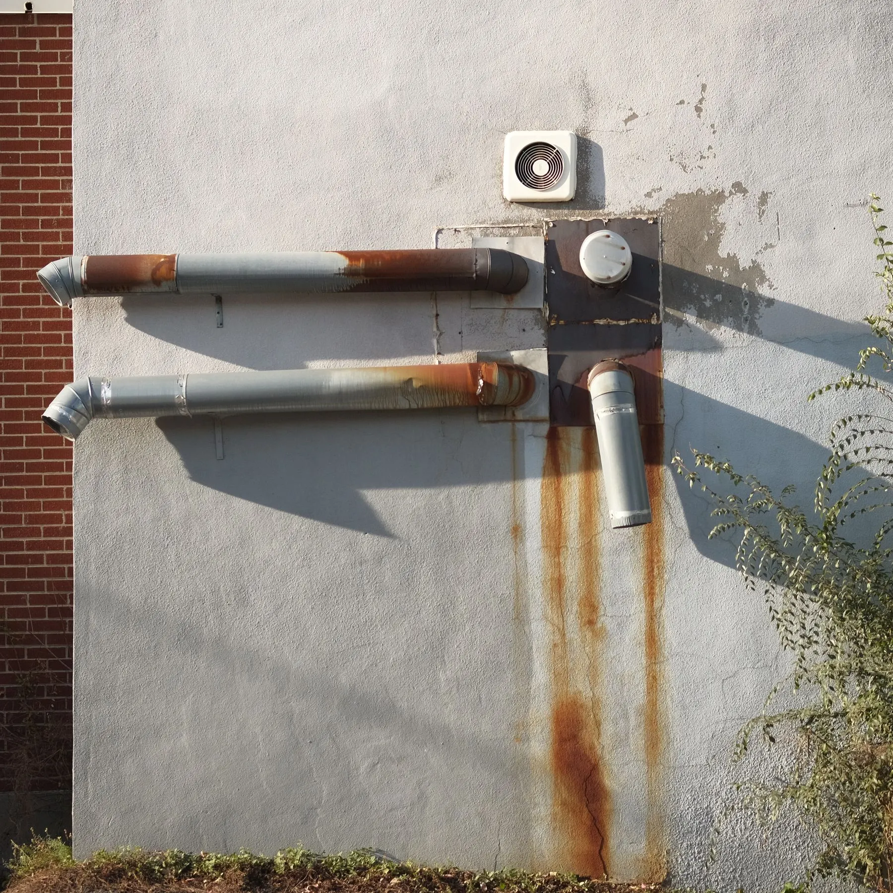 Exhaust vent pipes on an outside wall